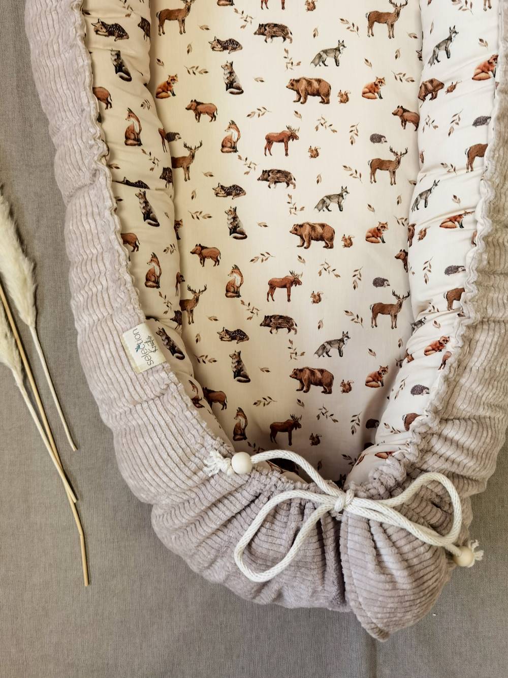 Selectionkreativ - mit einer Kordel kann man die Babynestchen größer oder enger stellen. Kuschelig und weich - perfekt für Neugeborene Babys